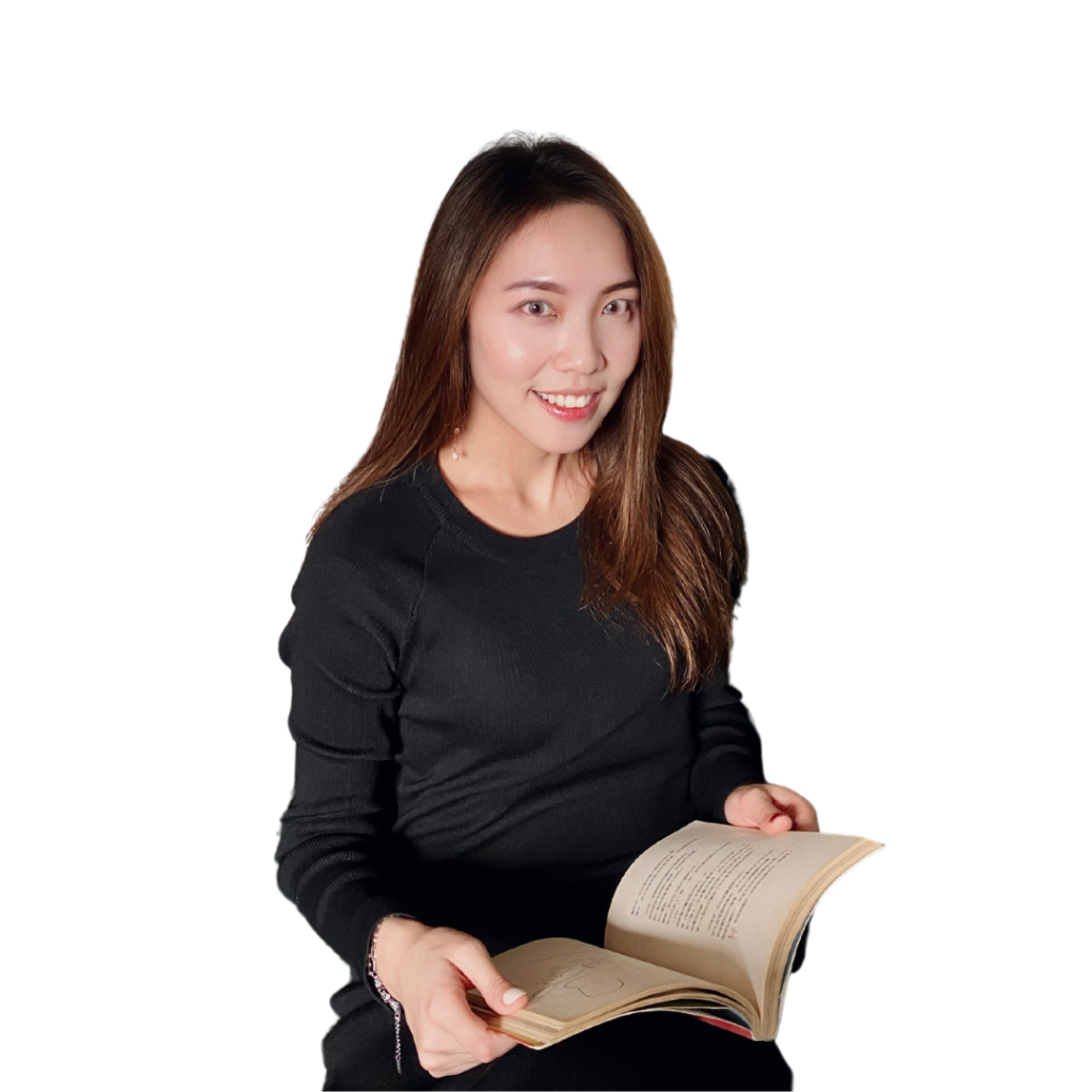 Woman sitting with a book woman wearing black sitting while holding a book