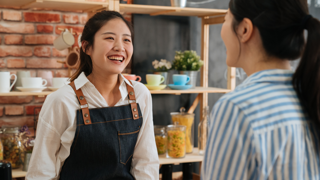 Happy Waitress Talking to a customer