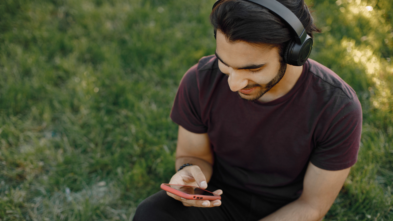 Man Using His Phone to study