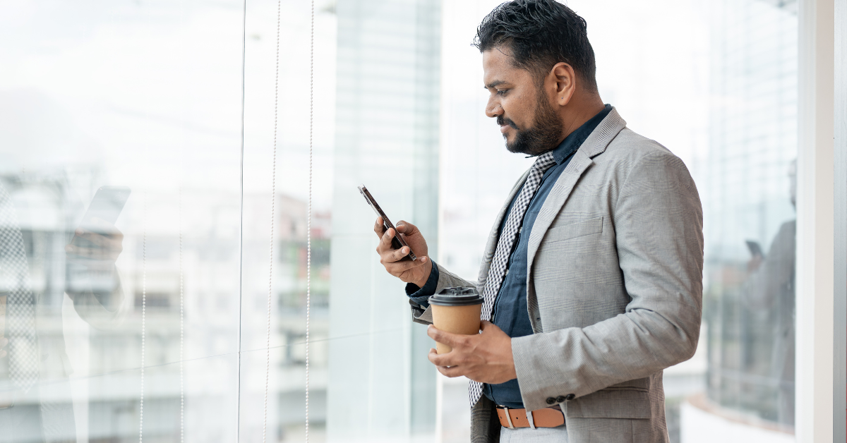 A professional Indian man using phone